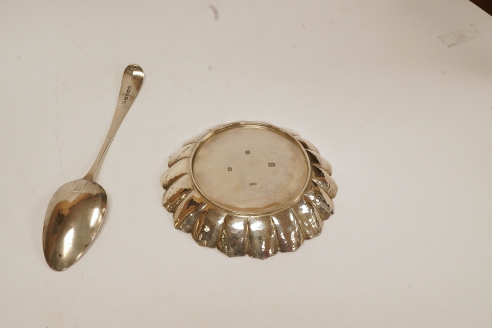 A modern silver dish by D.J. Anderson, London, 1998, diameter 14.4cm, together with a George III silver Old English pattern table spoon, by Peter, Ann & William Bateman, London, 1803, 7.8oz. Condition - fair to good